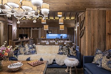 A living room with a couch and a chess board