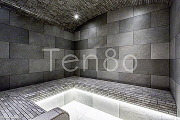 A picture of a sauna with the word ten80 on the wall