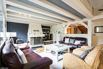 A living room with a fireplace and a couch