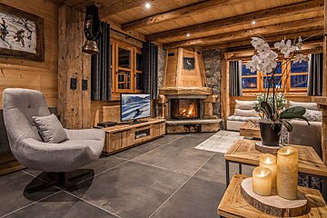 A bedroom with a bed and a sliding door leading to a bathroom
