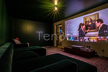 A projector screen shows a movie called ' chunk on earth '