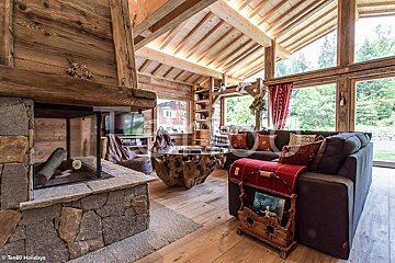 A living room with a fireplace and a couch