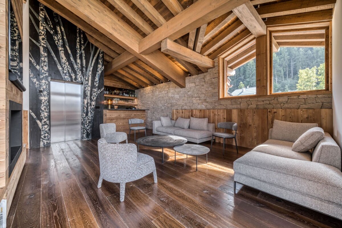 A living room with a couch and chairs in it