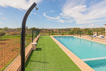 A large swimming pool with a fence around it