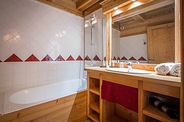 A bathroom with a bathtub and a sink