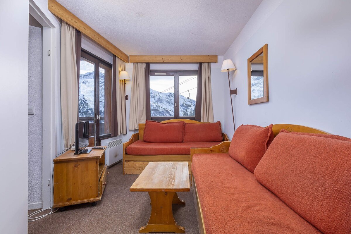 A living room with a couch and a television