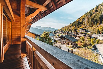 A balcony with a view of a mountain village