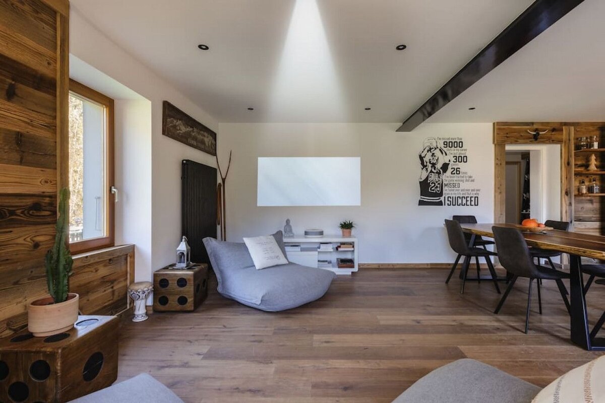 A living room with a poster of michael jordan on the wall