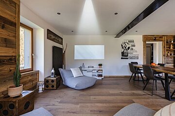 A living room with a poster of michael jordan on the wall
