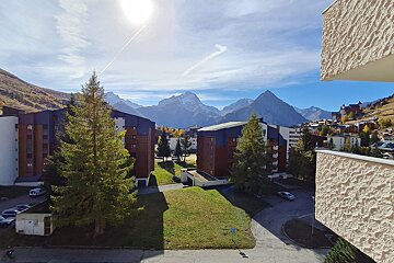 A view of a city with mountains in the background
