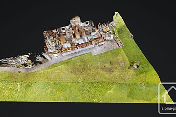 An aerial view of a house with the word alpine on the bottom right