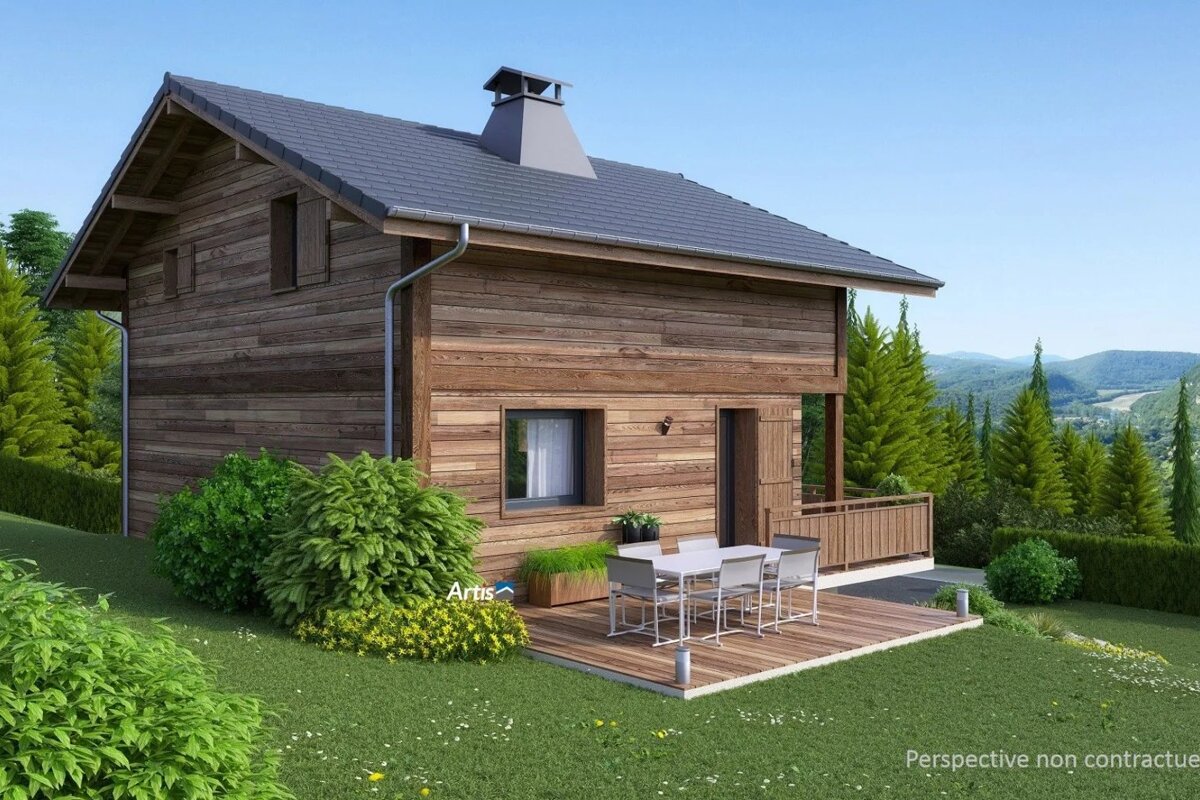 A modern wooden chalet on a green hillside with a patio dining set, surrounded by pine trees and mountain views.