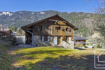 A picture of a house in the mountains taken by alpine pro
