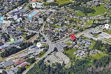 An aerial view of a city with richard bozon sports centre and planards ski lift and attractions