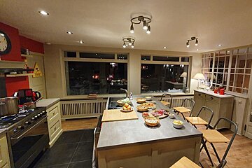 A kitchen with a sign on the wall that says ' coca cola '