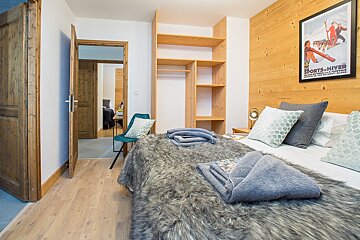 A bedroom with a poster on the wall that says sports-hiver