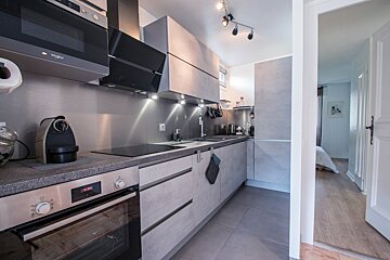A kitchen with a whirlpool oven and microwave