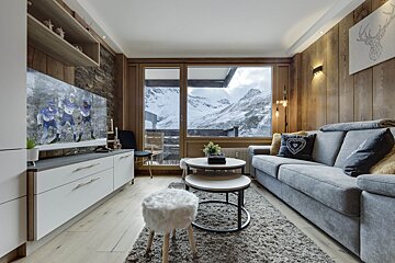 A living room with a couch and a flat screen tv