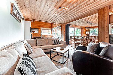 A living room with a couch a chair and a coffee table