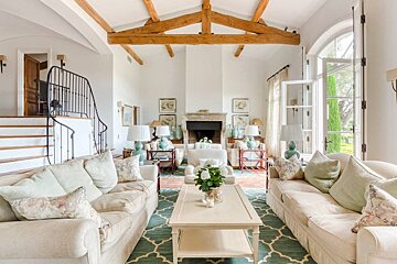 A living room filled with furniture and a fireplace