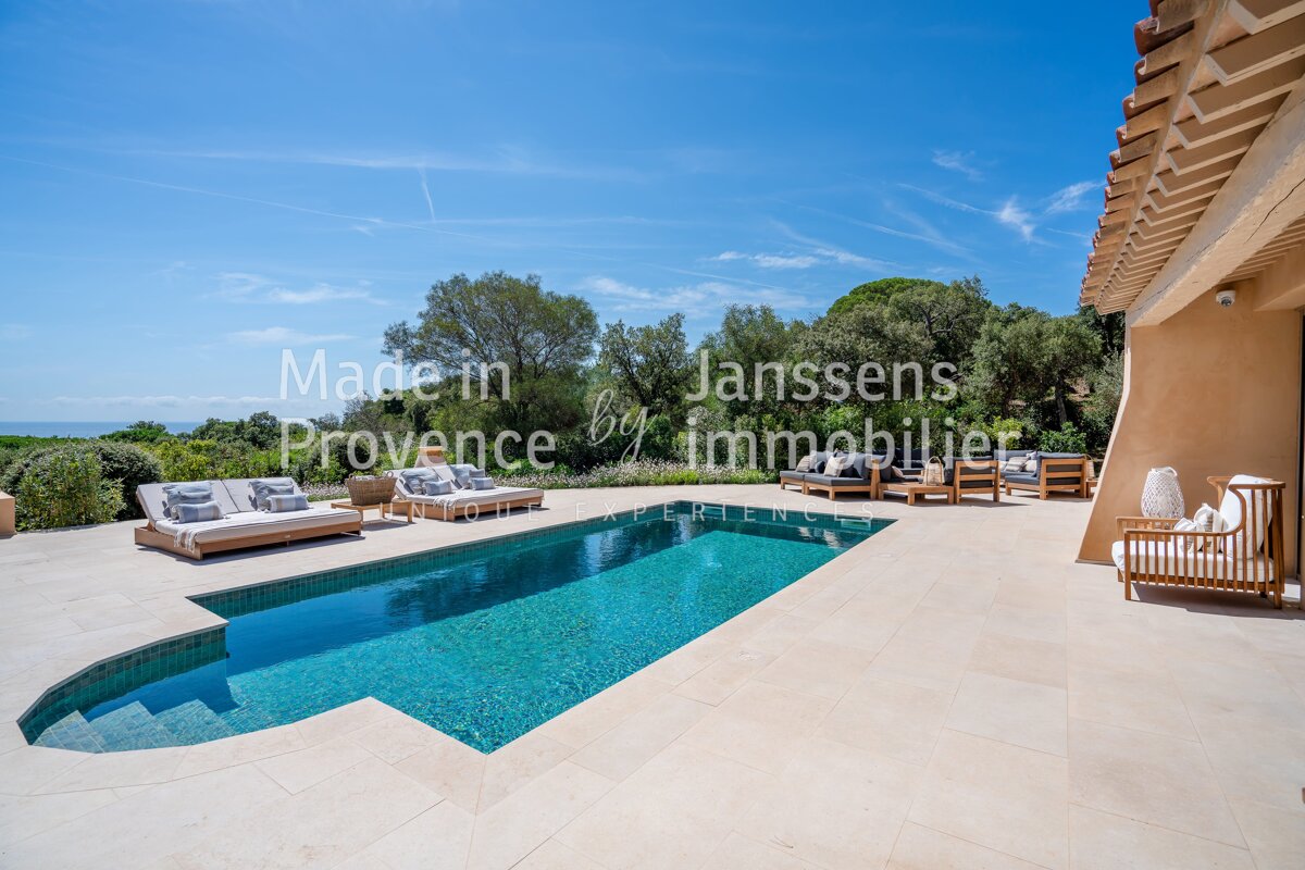 A large swimming pool with the words made in provence by janssens immobilier