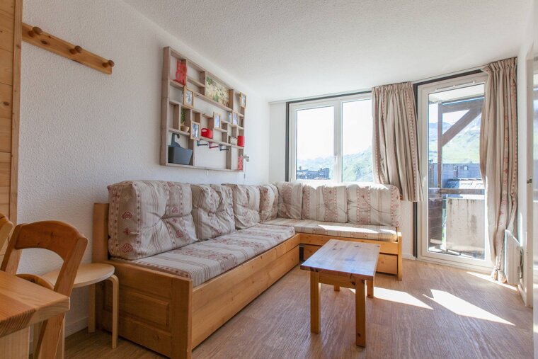 A living room with a couch and a table