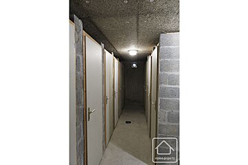 A long hallway with a sign that says alpine property