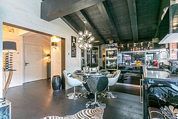 A living room with a fireplace and a zebra rug