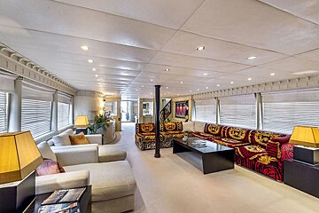A living room with a couch that says versace on it