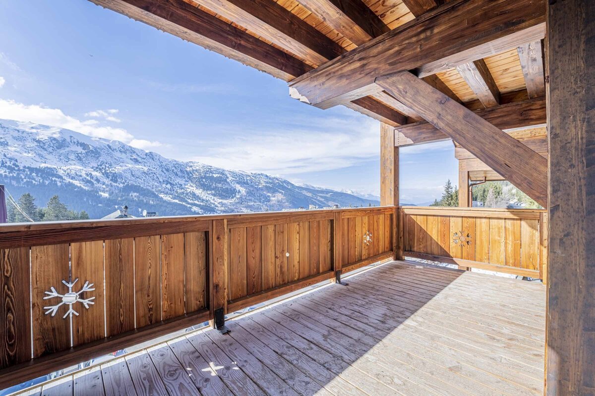 A balcony with a snowflake design on the railing