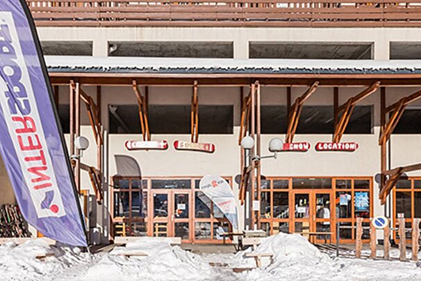 A building with a sign that says snow location