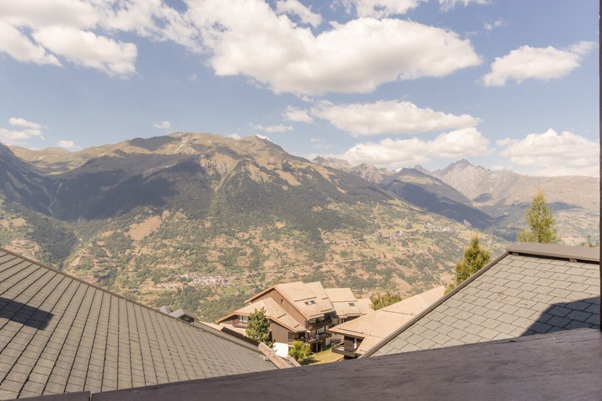 A view of a mountain range from a balcony