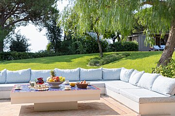 A table with a bowl of fruit on it