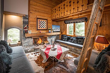 A living room with a fireplace and a couch