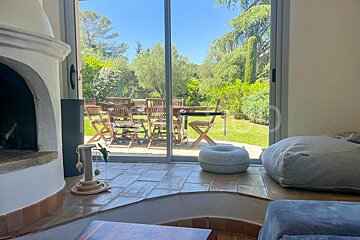 A living room with a sliding glass door leading to a patio