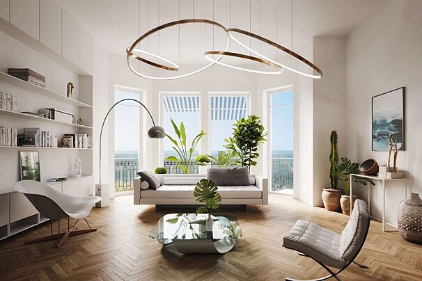 A bright, modern living room with large windows, lush plants, contemporary furniture, and a unique abstract ceiling light. Wooden floors complete the chic space.