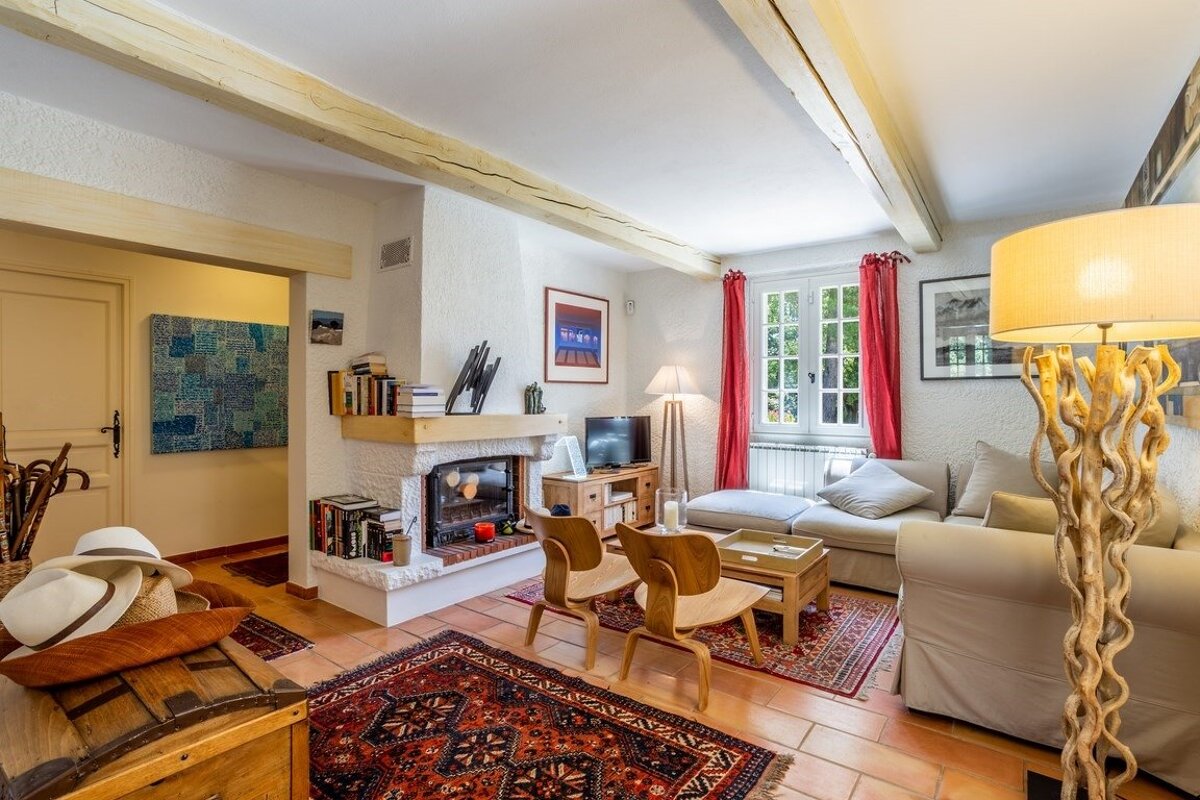 A living room with a fireplace and a couch