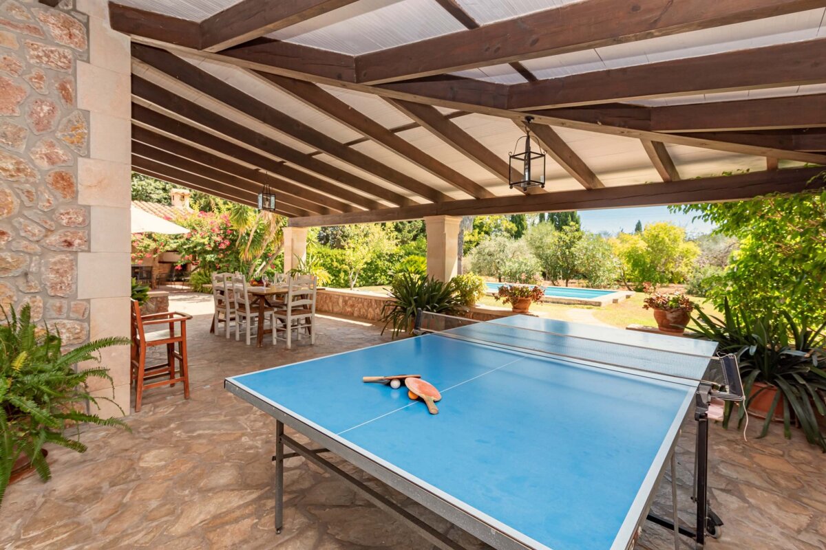 A table with ping pong balls and rackets on it