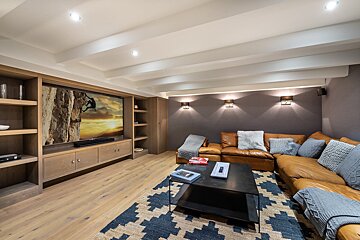A living room with a couch and a flat screen tv