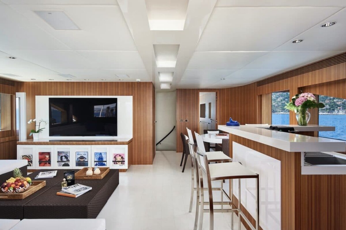 A living room with a flat screen tv and a coffee table