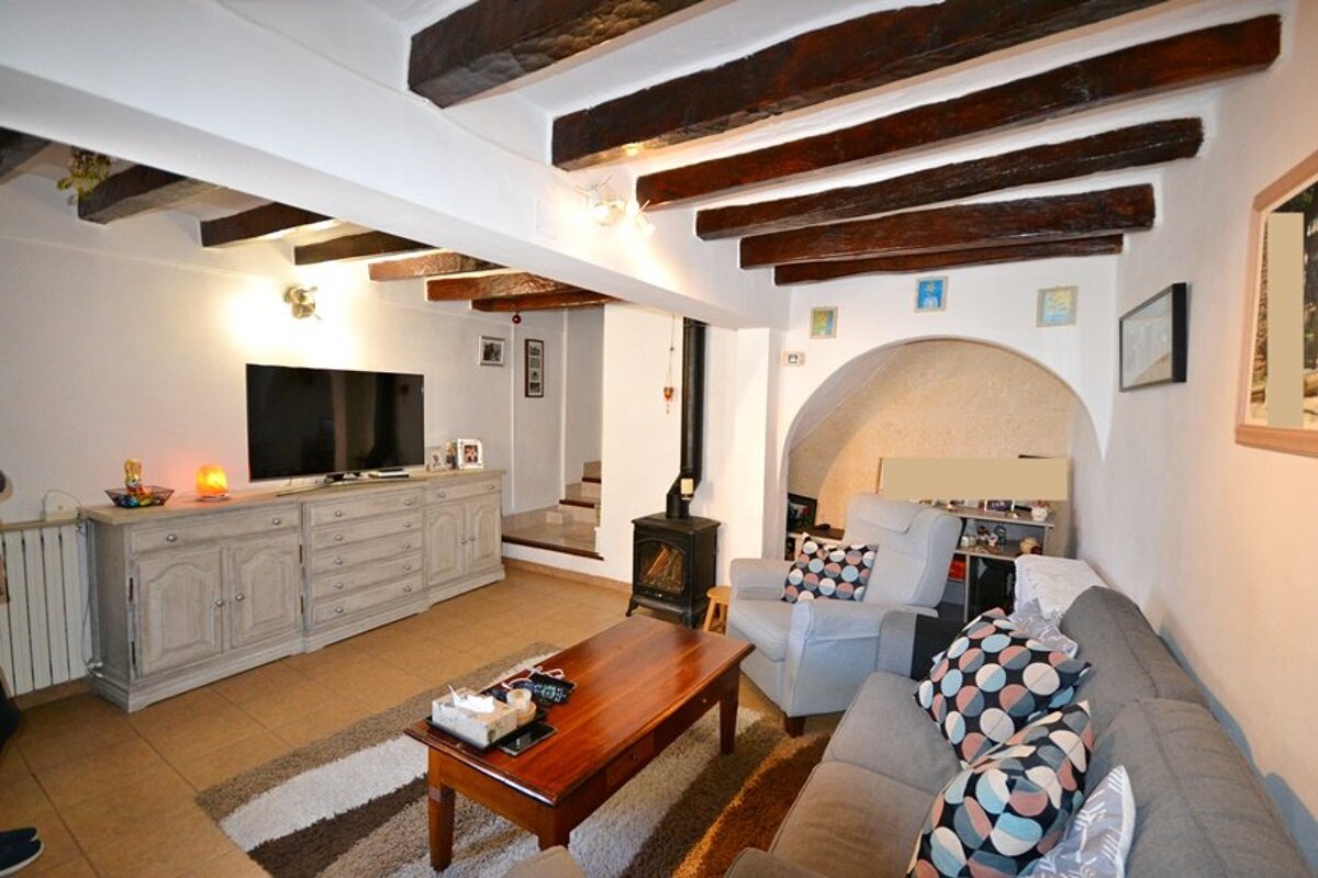 A living room with a couch and a flat screen tv