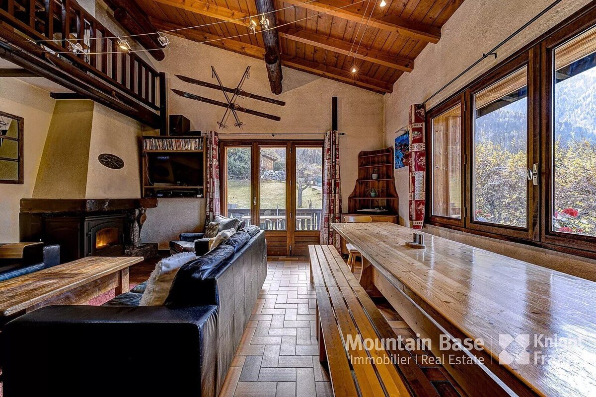 A living room with a couch and a table that says mountain base