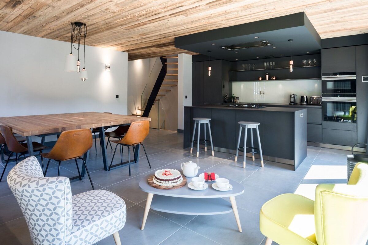 A cake sits on a coffee table in a kitchen