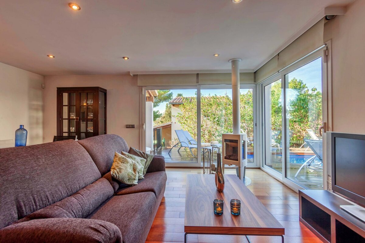 A living room with a couch and a flat screen tv