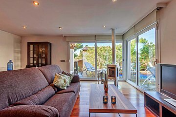 A living room with a couch and a flat screen tv