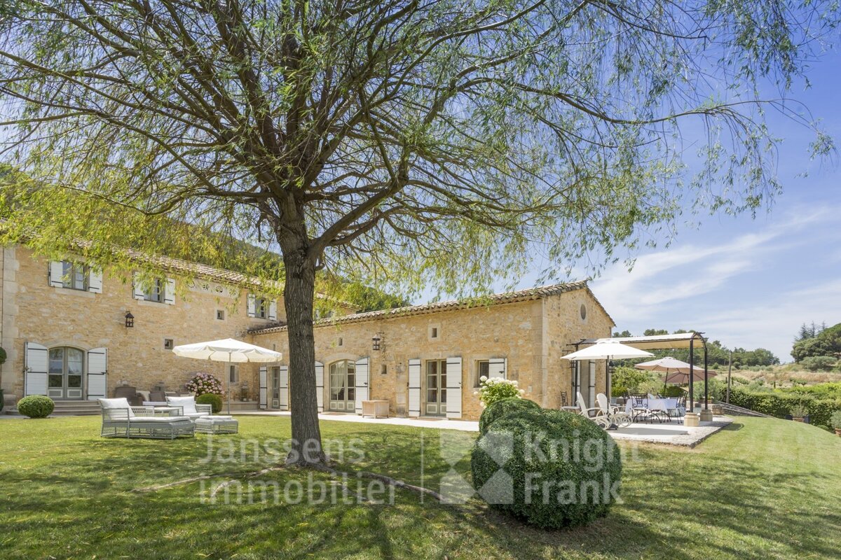 A large stone house is for sale by janssens immobilier