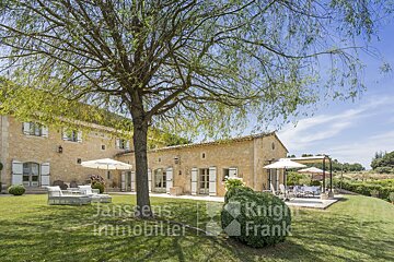 A large stone house is for sale by janssens immobilier