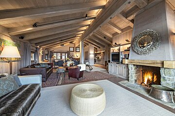 A living room filled with furniture and a fireplace