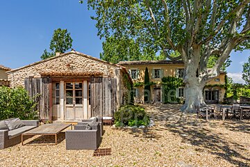 A house with a large tree in front of it