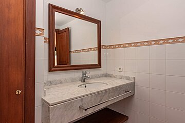 A bathroom sink with a mirror above it